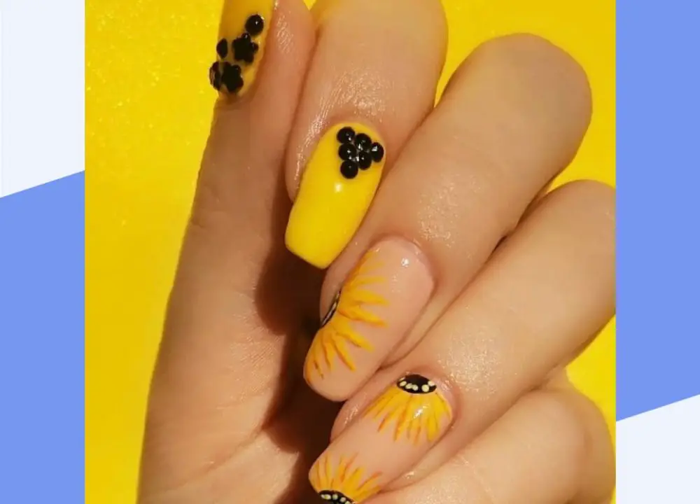4. Cute and Easy Sunflower Nail Design Ideas - wide 10